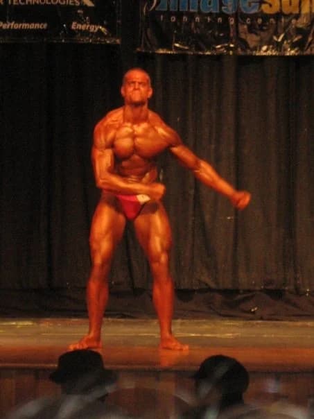 Jarred Curcio on stage at his natural bodybuilding championship