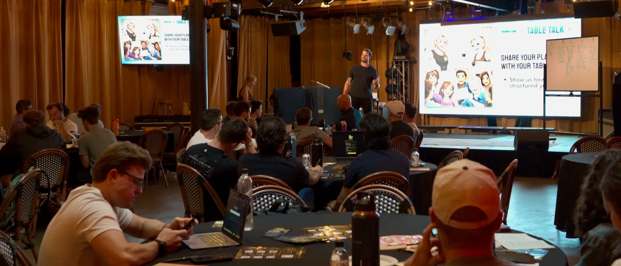 The crowd at The Focus Lab watching Jarred Curcio present from the stage in Austin, Texas