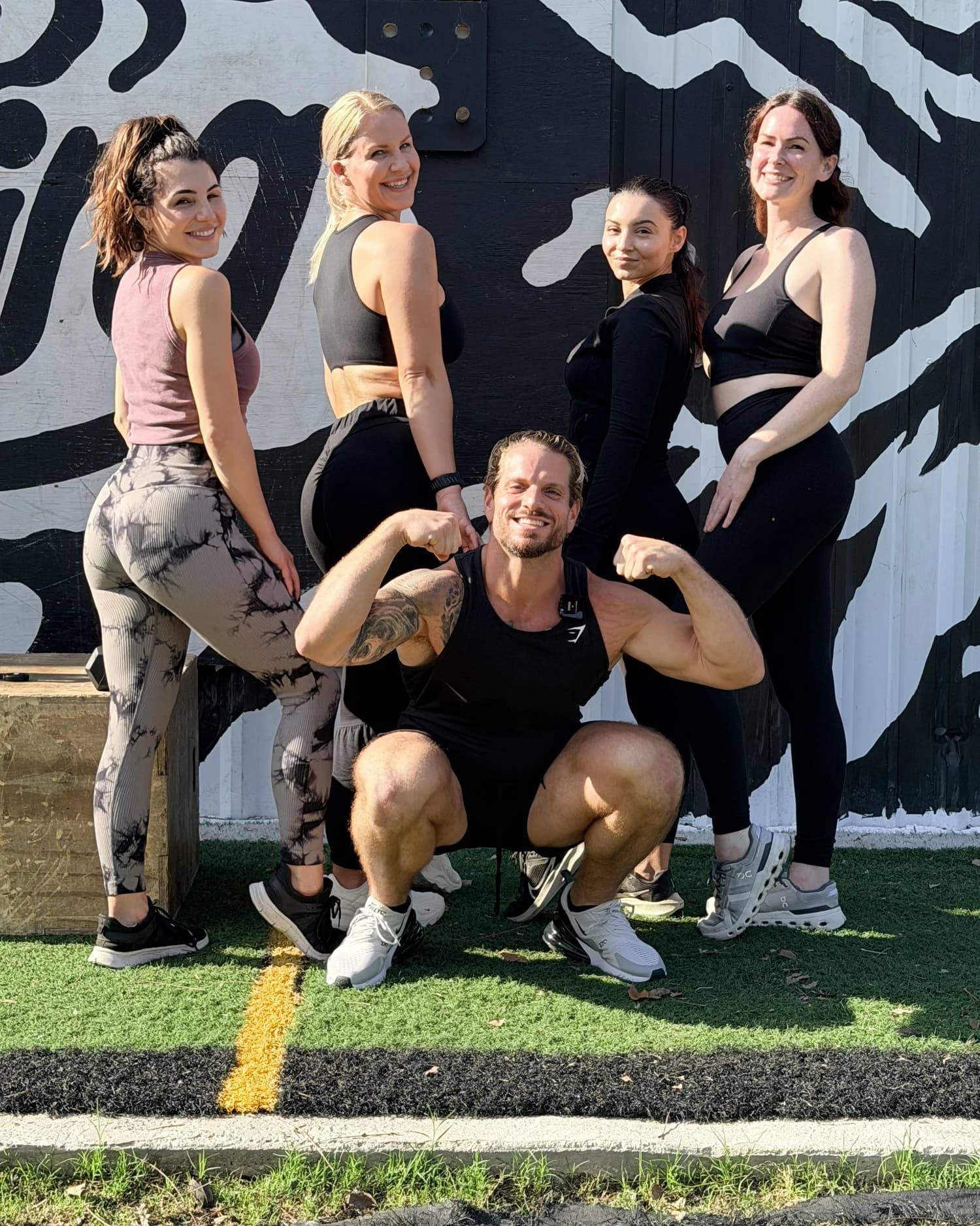 Jarred Curcio flexing with Katelyn Curcio and the crew at Squatch in Austin, Texas