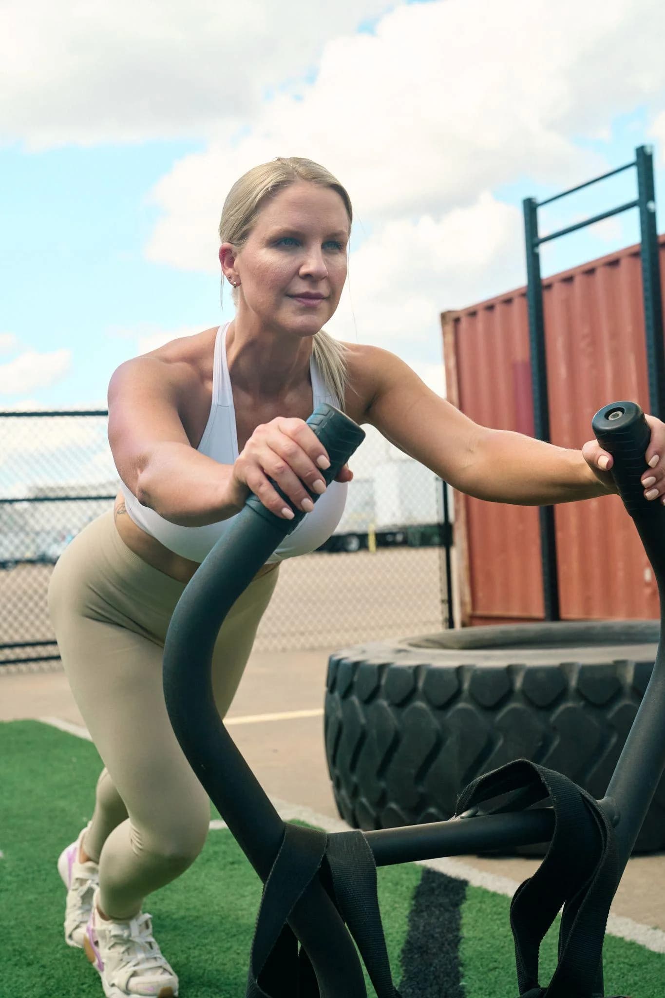 Katelyn Curcio pushing a weighted sled during a training session in Austin, Texas