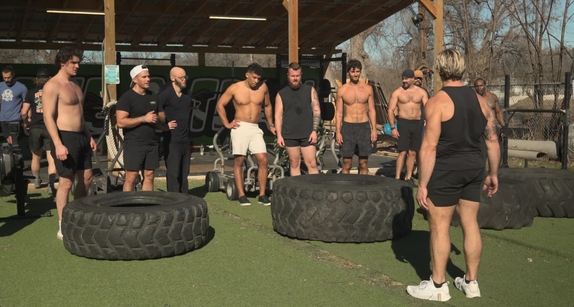 Jarred Curcio with the group between tire flip rounds at an outdoor training session in Austin, Texas