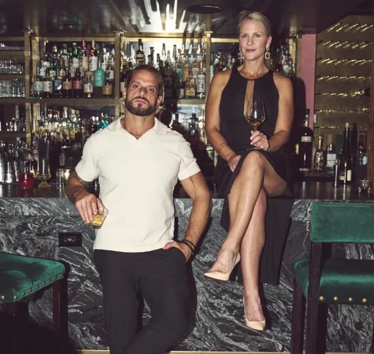 Jarred and Katelyn Curcio side by side at a bar