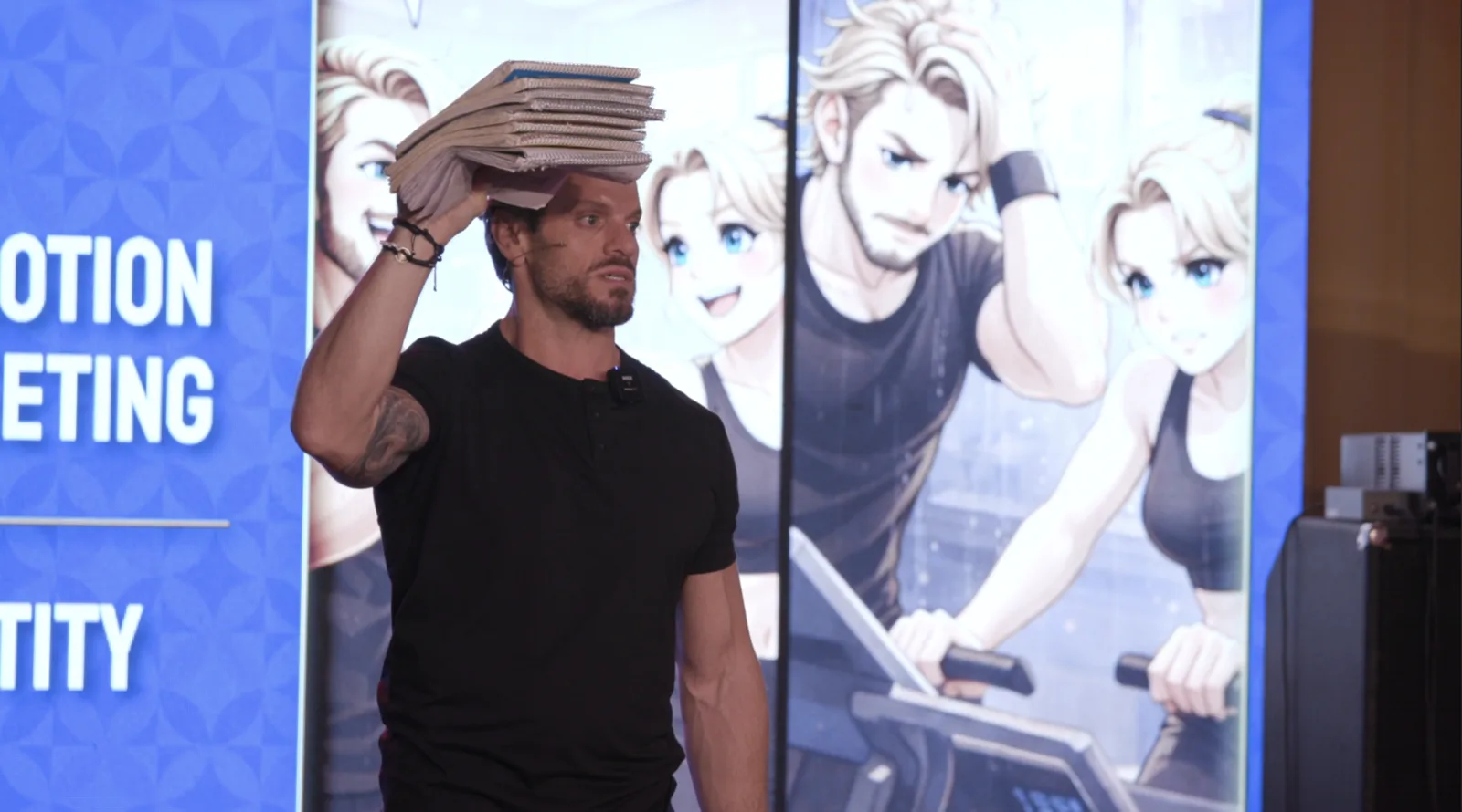 Jarred holding the stack of notebooks from The Focus Lab